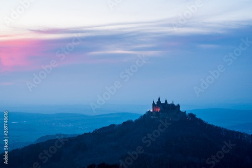 Germany, Afterglow red sky decorating magic hohenzollern castle in the evening photo