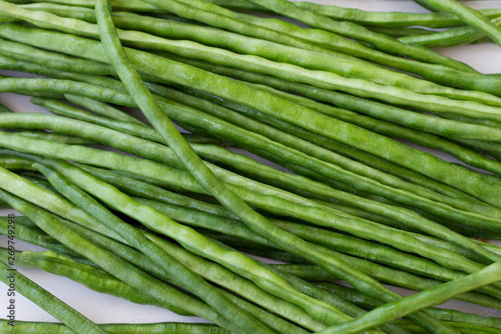 Green beans lying on the table background Green beans lying on the table background