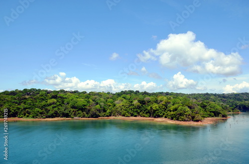 Green landscape of the Panama Canal, view from transiting container ship. © Mariusz
