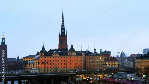 Wallpaper Mural Stockholm, Sweden. View of Gamla Stan in Stockholm, Sweden with landmarks like Riddarholm Church during the evening. View of old buildings and car traffic and subway Torontodigital.ca