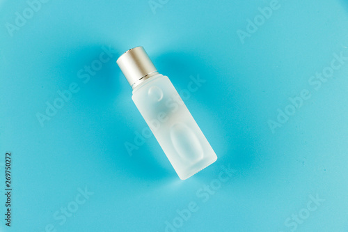 Facial cleansing toner on a blue background