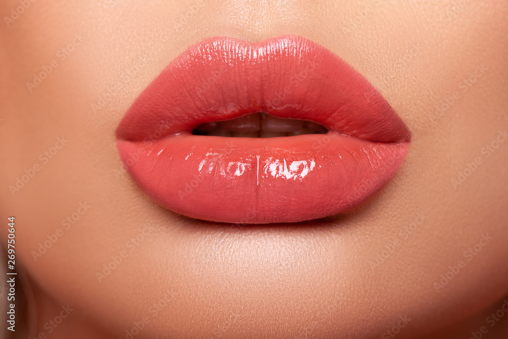 Fototapeta premium Beautiful lips macro. Beauty. mouth. smile. Closeup Model lips beige in Studio. - image 