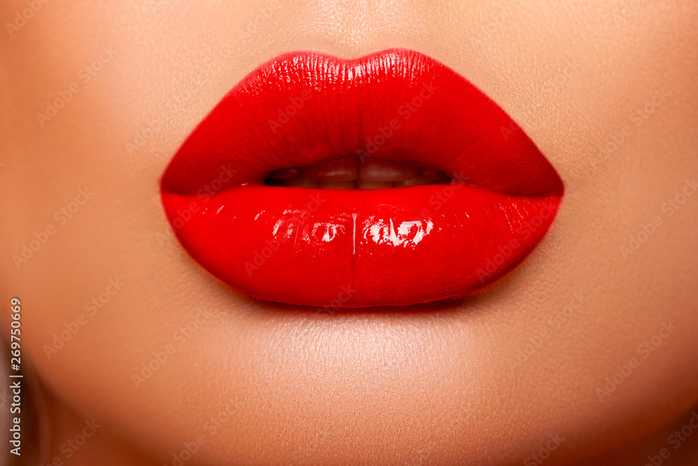 Red Lip gloss. Beautiful natural lips Red color. Sexy Lips. Beautiful  Make-up Closeup. Lip Gloss Cherry Color. Texture. Volume and Beauty of the  Lips. Plump lips Photos | Adobe Stock