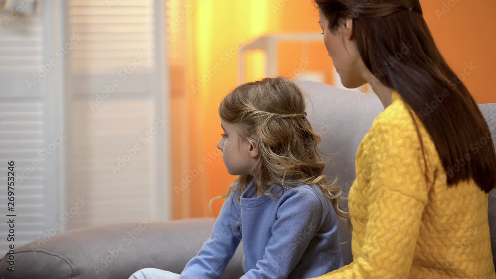 Offended girl turned away from mother, mom scolding daughter for bad behaviour Offended girl turned away from mother, mom scolding daughter for bad behaviour