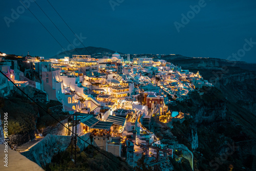 Santorini at Night, one of the most beautiful travel destinations of the world. Panoramic View at the Capital of the island, Fira © Lambros Kazan