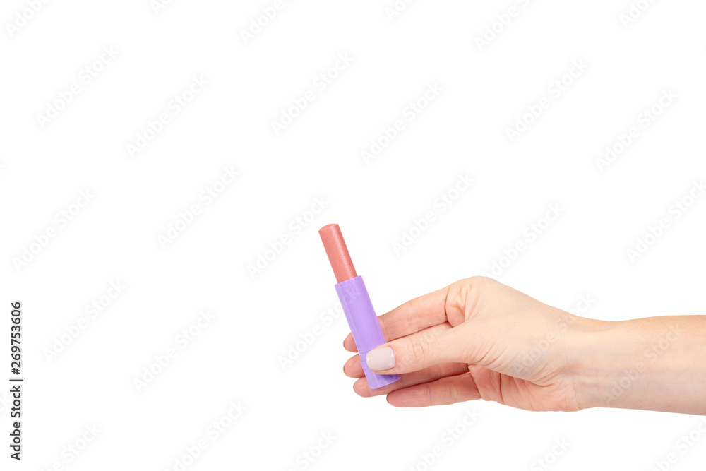 Hand with pink balm lipstick, lips care and beauty Hand with pink balm lipstick, lips care and beauty