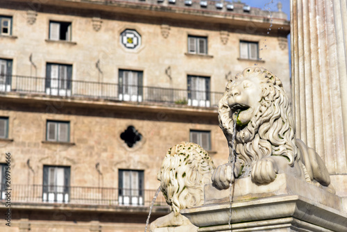 Lion's Fountain (foreground) and Convento San Francisco de Asis at Plaza de San Francisco, Havana old town, Cuba