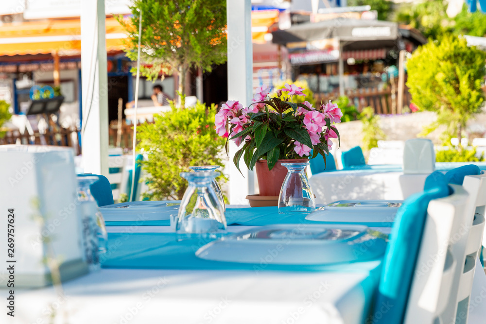 Beautifully laid table in an outdoor cafe in the southern resort town