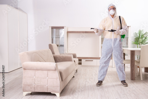 Pest control contractor working in the flat  © Elnur