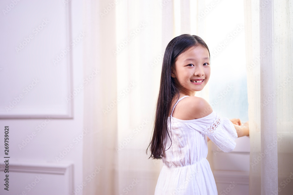 beautiful little asian girl looking at camera smiling beautiful little asian girl looking at camera smiling