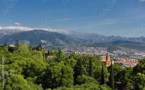 View of Hotel Alhambra Palace from Alcazaba and the snowy Sierra Nevada mountains Granada