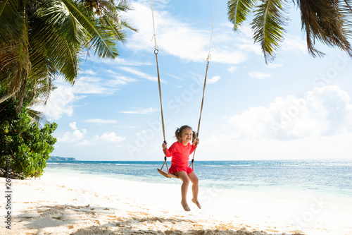 Little Girl Swinging On The Beach © Andrey Popov