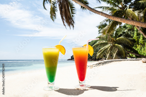 Colorful Cocktail Glasses On The Sandy Beach