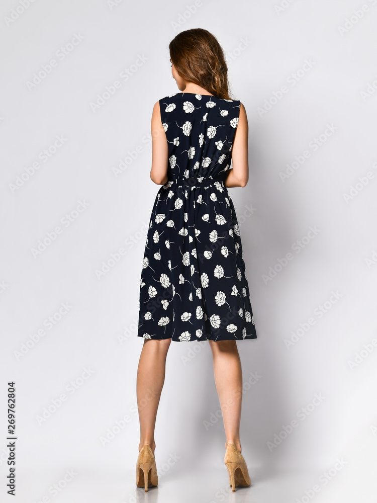 Woman in Long Floral Dress in Fashion Store - Portrait of girl in a clothes shop in a maxi summer dress