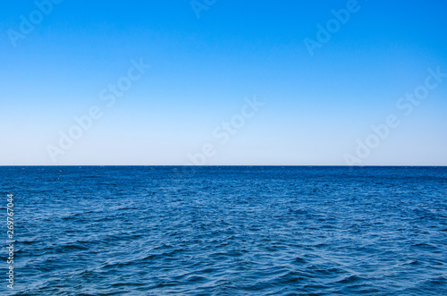 Seascape, view of sea horizon and blue sky