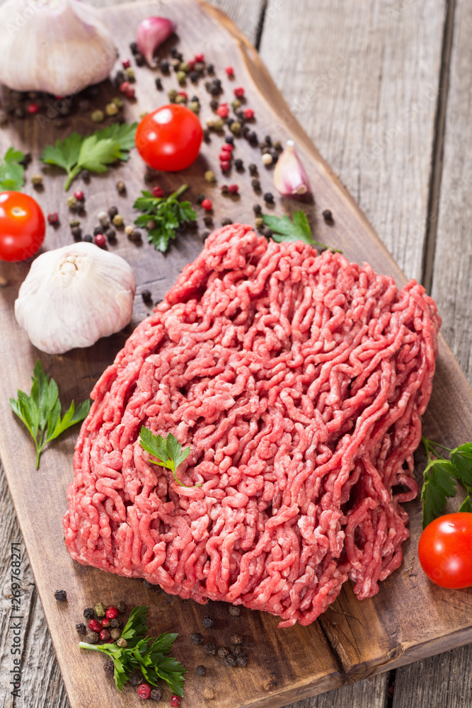 Raw minced beef meat with spices and herbs Raw minced beef meat with spices and herbs