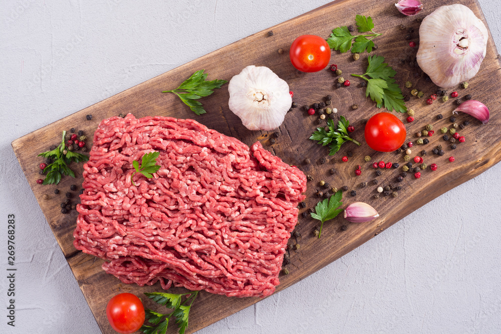 Raw minced beef meat with spices and herbs Raw minced beef meat with spices and herbs