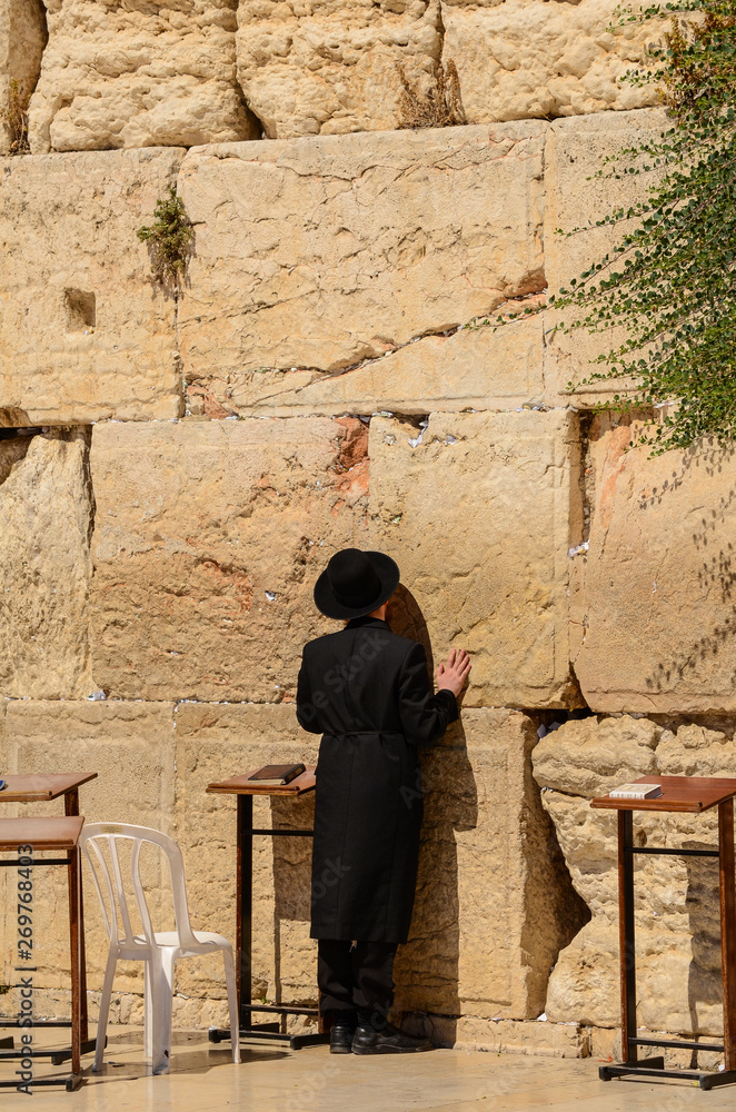 Orthodox Jewish man praying at the Western Wall in Jerusalem, Israel