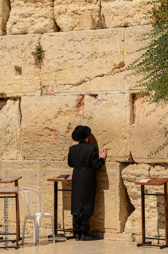 Orthodox Jewish man praying at the Western Wall in Jerusalem, Israel © Nancy Anderson