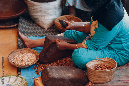 фотографія Woman making argan oil by hand craft