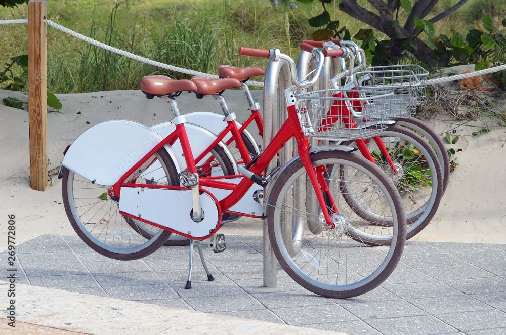 Bicycles parked at the entrance to a beach in southeast Florida Bicycles parked at the entrance to a beach in southeast Florida