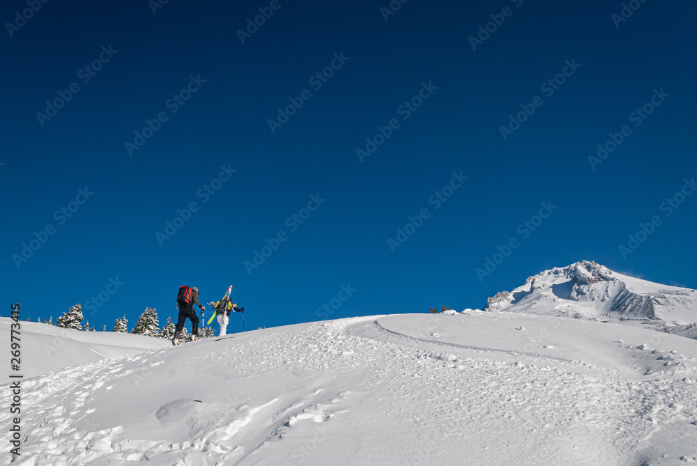 Skiers Heading Up the Mountain