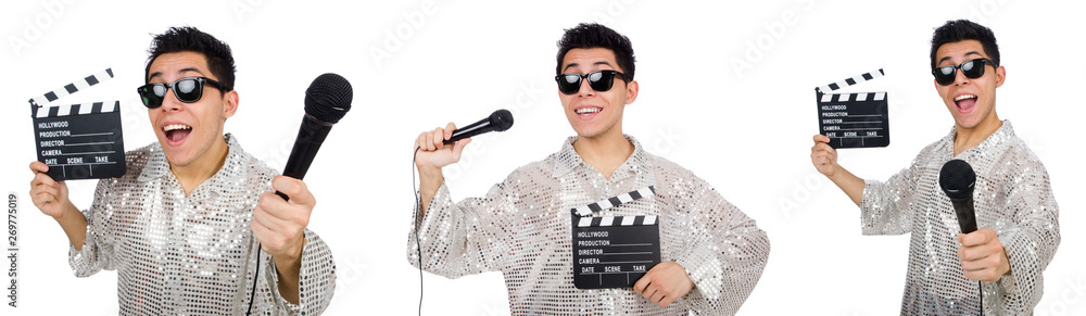 Young man with microphone and clapperboard isolated on white