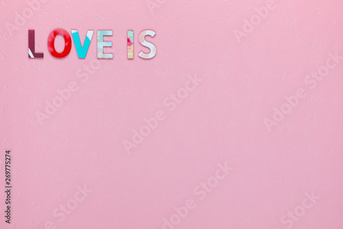 Words Love Is, on pink background, arranged top left