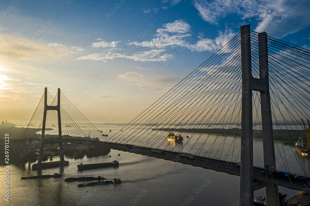 Fototapeta premium Shipping under Phu My Bridge ,Saigon River, Ho Chi Minh City, Vietnam