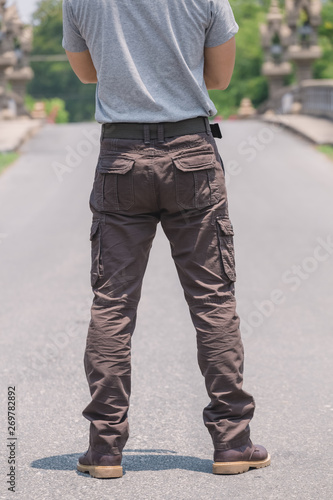 Model wearing brown color cargo pants or cargo trousers