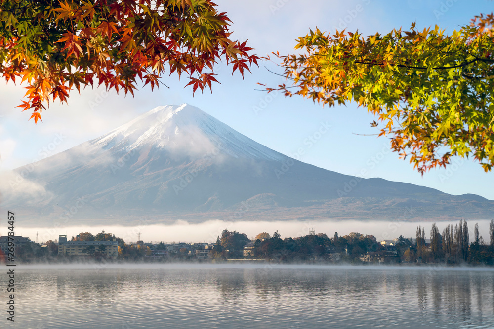 Japan Colorful Autumn Landscape and Mountain Fuji with morning fog and nature red maple leaves at lake Kawaguchiko near Tokyo is one of the best destination for travel tourism in Asia.