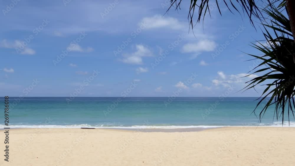 Beautiful sky and sea water with coconut leaves on top at Karon Beach, Phuket, Thailand Beautiful sky and sea water with coconut leaves on top at Karon Beach, Phuket, Thailand