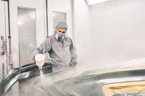 A man painting a car