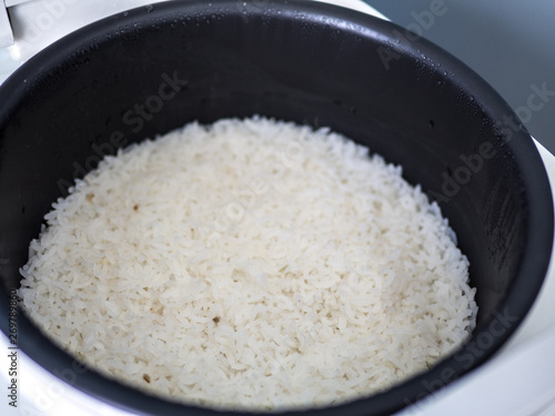 Steam rice in electronic cooker.