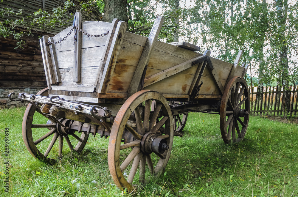 Old traditional wooden horse drawn carriage in Masuria region of Poland
