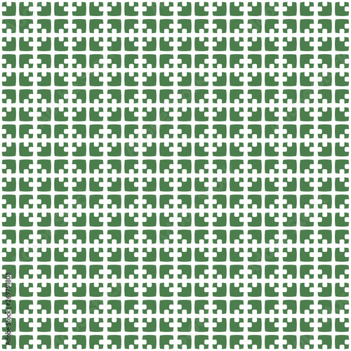 Abstract geometric pattern with tight grid shapes in green and white colors.
