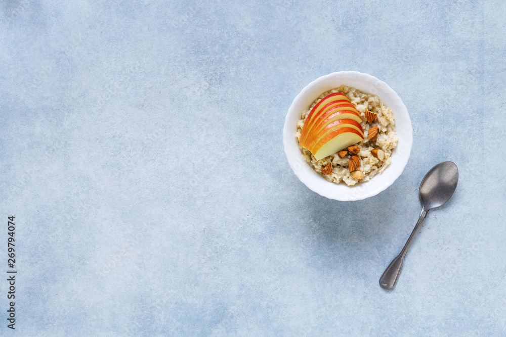 Healthy breakfast Oatmeal porridge with apples and nuts served in a bowl. Healthy breakfast Oatmeal porridge with apples and nuts served in a bowl.