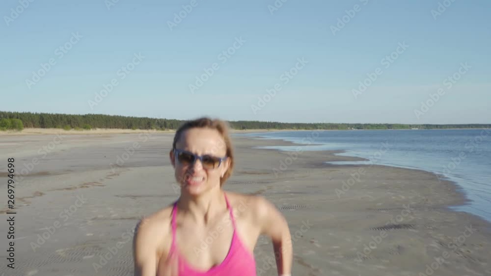 independent young woman athlete running on beach exercising female runner sprinting training in sunny seaside background independent young woman athlete running on beach exercising female runner sprinting training in sunny seaside background