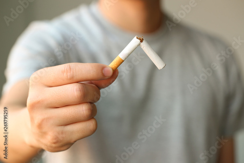 Male hand deduct cigarette.Quitting from addiction conceptQuit smoking breaks a broken Stop Smoking 