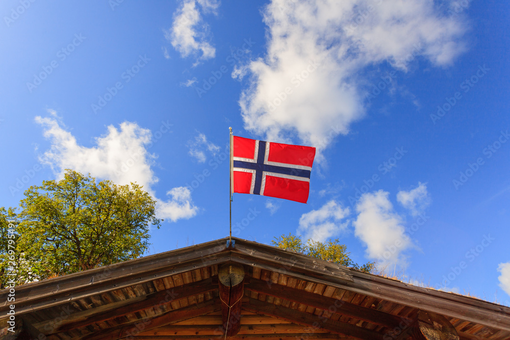 The norwegian flag against blue sky