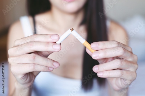 Healthy quit concept By the image of a woman wasting cigarettes