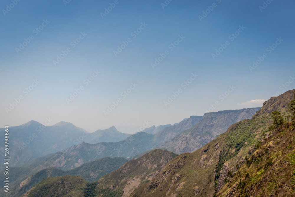 Naklejka premium Mountain range with blue sky