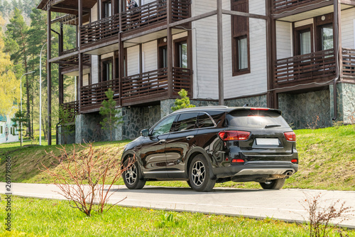 Wallpaper Mural Black SUV near the holiday homes in the resort in the mountains Torontodigital.ca