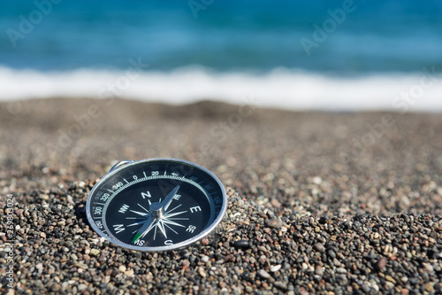 Navigational compass on the beach, Close up, Selective focus