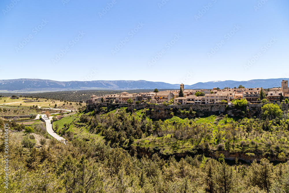 Pedraza, Castilla Y Leon, Spain: view of Pedraza village from Mirador the Tungueras, with the Sierra de Guadarrama behind. Pedraza is one of the best preserved medieval villages of Spain