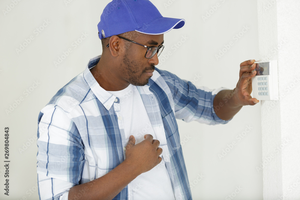 men regulate temperature on control panel men regulate temperature on control panel