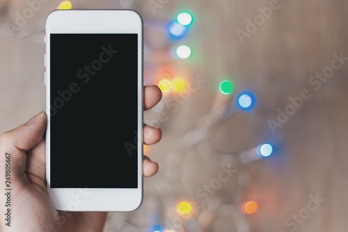 Close-up of A Hand Holding Mobile Phone, Cropped Hand Holding Mobile Phone with black screen and blur back ground