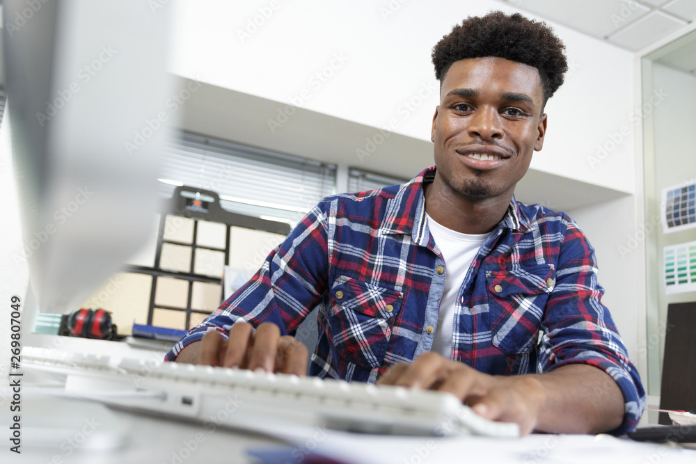 creative man working in office on laptop creative man working in office on laptop