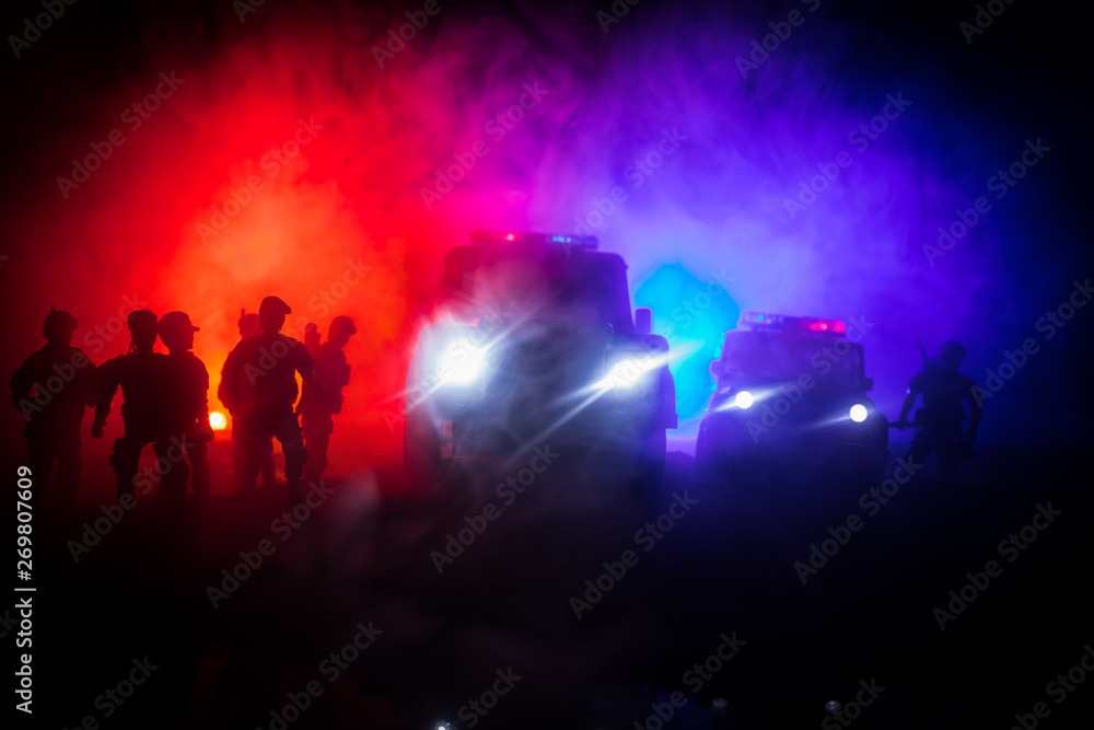 Police cars at night. Police car chasing a car at night with fog background. 911 Emergency response pSelective focus Police cars at night. Police car chasing a car at night with fog background. 911 Emergency response pSelective focus