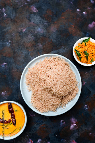 String hoppers, a famous breakfast food in Sri Lanka, India and Singapore. They are made up of rice or wheat flour. photo